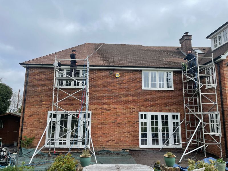 Roof cleaning carried out safely from scaffold towers by The Roof Moss Cleaners in Liphook